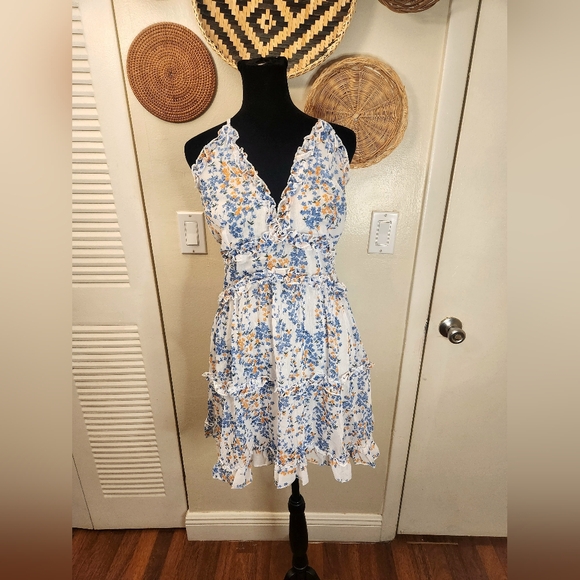 LAST ONE! Blue And White Floral Mini Dress With Ruffles And Criss-Cross Back - Picture 6 of 11